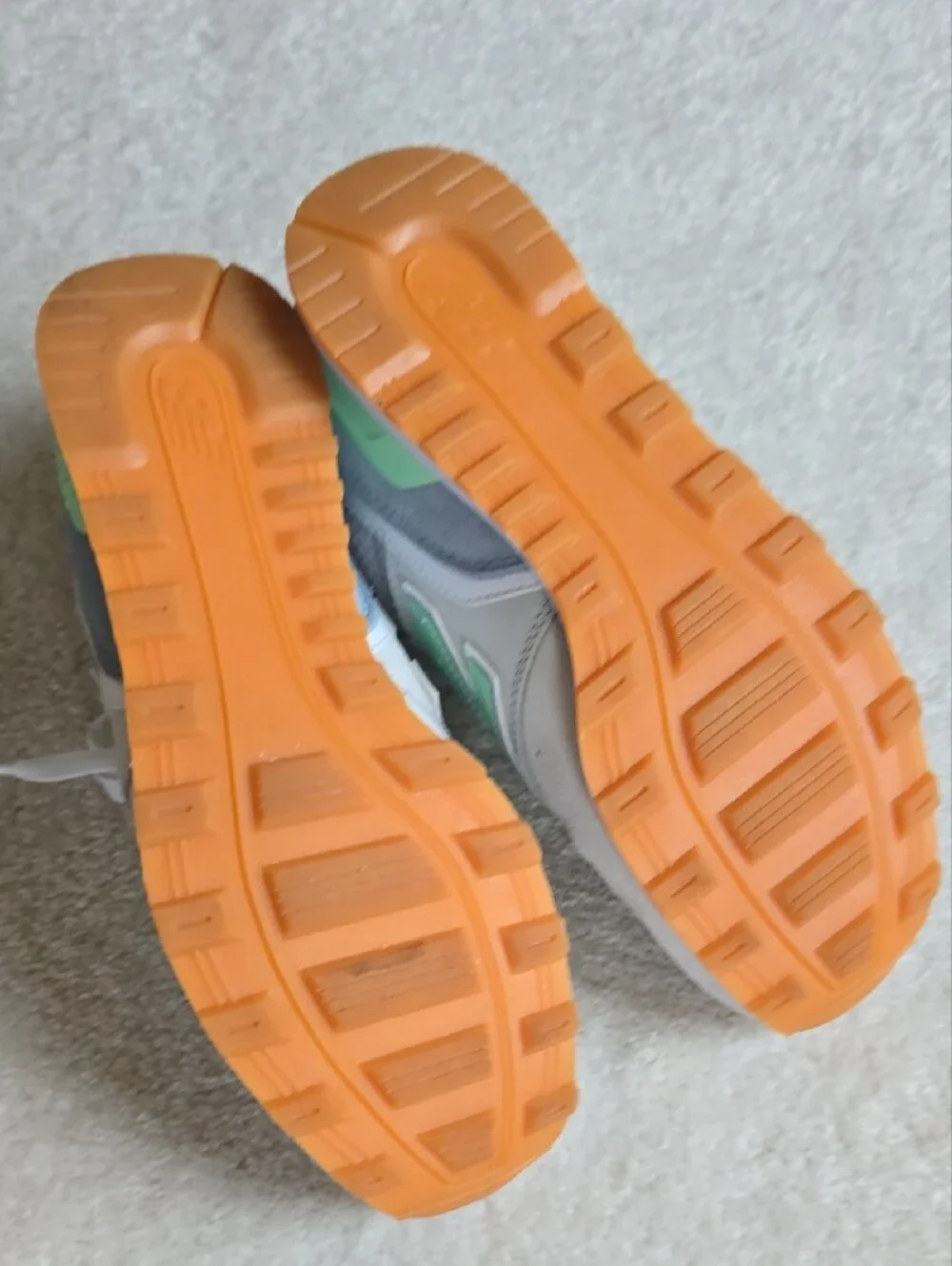 New Balance sneakers in mint green and light gray